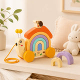 Wooden snail rainbow stacker shown next to a wooden ruler for size reference, approximately 20 centimeters tall