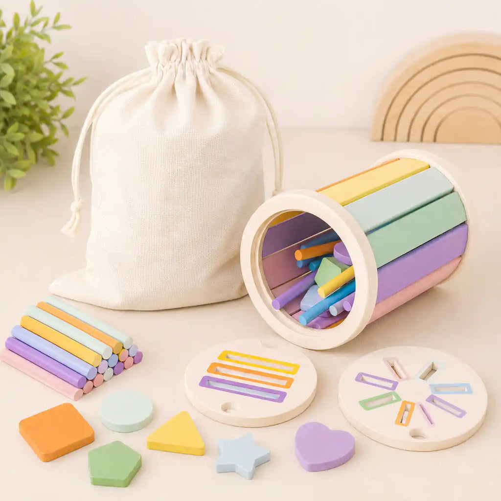 Close-up details of the wooden sorting cylinder showing the lid cutouts, vertical pastel bars, round dowels, and rectangular slot disc