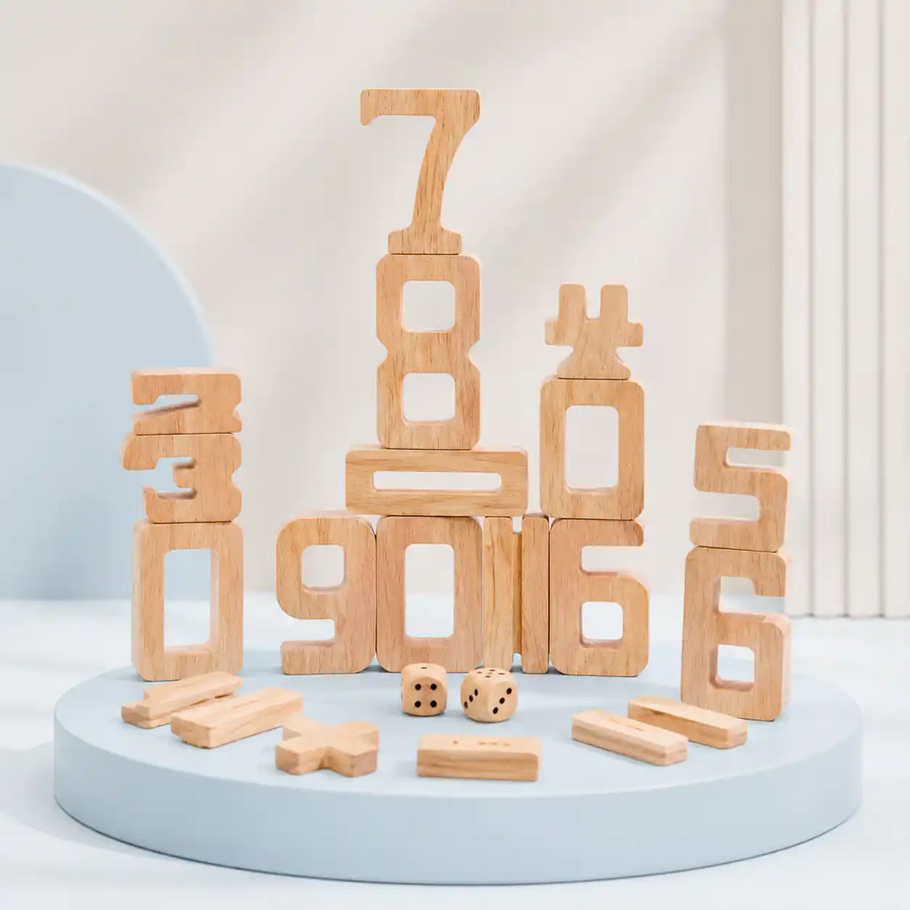 Wooden stacking number blocks 0 to 10 arranged on a soft blue display, with wooden math operators and dice in the foreground