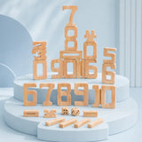 Dimensions diagram for wooden stacking number blocks showing the 1, 5, 6, and 10 pieces with proportional heights and the 2 cm dice