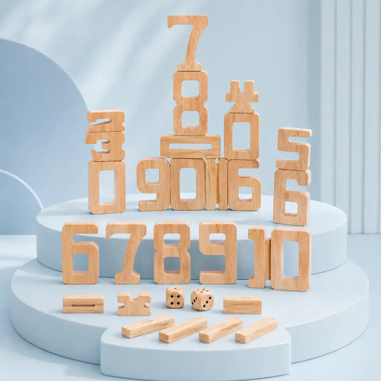 Dimensions diagram for wooden stacking number blocks showing the 1, 5, 6, and 10 pieces with proportional heights and the 2 cm dice