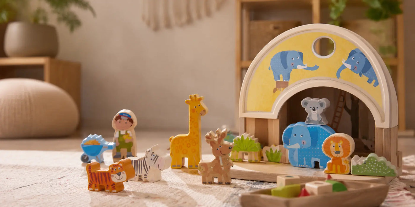 wooden animal toys in a soft neutral playroom — JuniSprouts Montessori-inspired animal toys for imaginative play